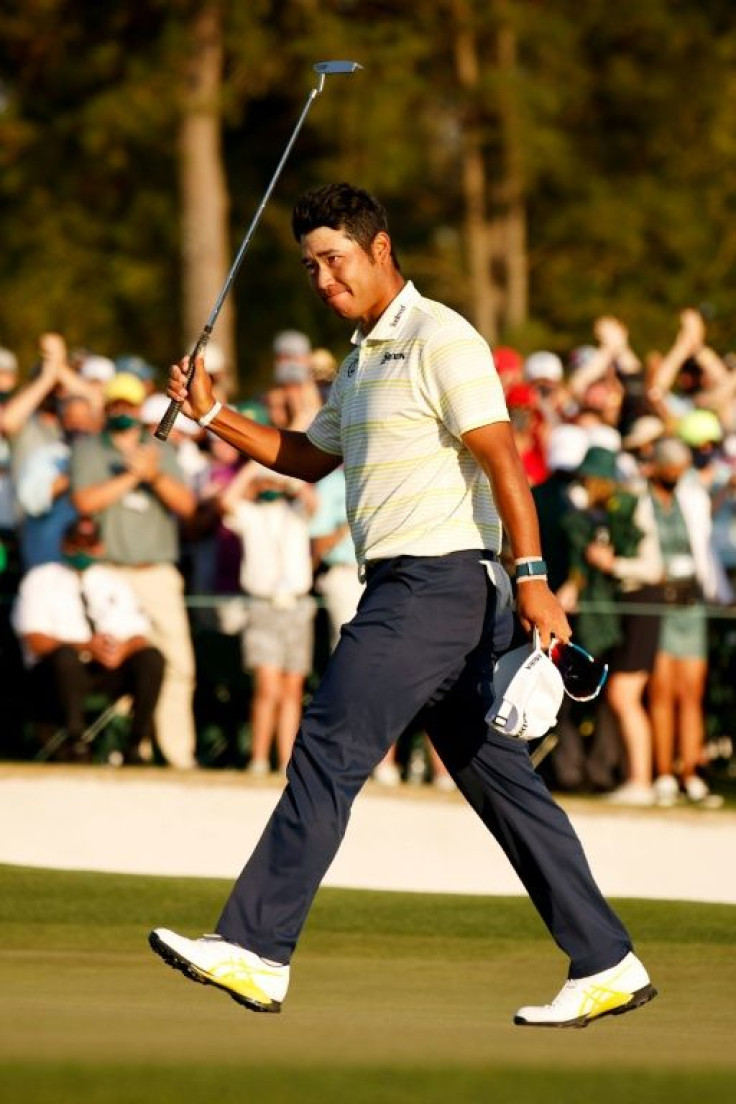 Hideki Matsuyama of Japan celebrates on the 18th green after clinching his Masters victory