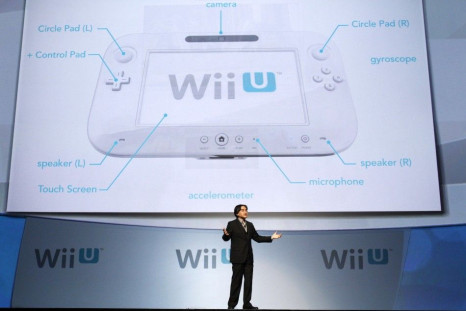 Satoru Iwata, president of Nintendo Co., Ltd., presents the new Wii U controller at a media briefing during the Electronic Entertainment Expo, or E3, in Los Angeles June 7, 2011