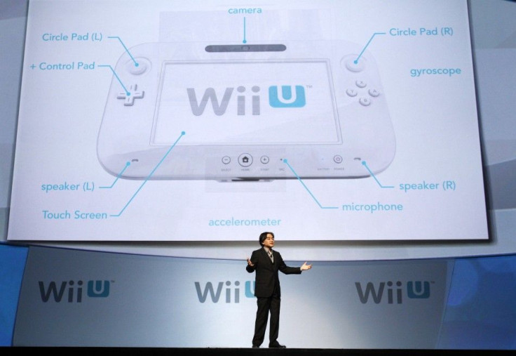 Satoru Iwata, president of Nintendo Co., Ltd., presents the new Wii U controller at a media briefing during the Electronic Entertainment Expo, or E3, in Los Angeles June 7, 2011