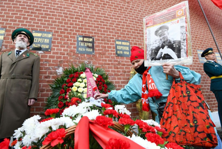 Russian Communist party supporters lay flowers at Gagarin's grave