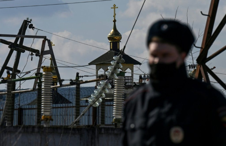 A Russian police officer patrols outside the penal colony N2, where Kremlin critic Alexei Navalny is serving his sentence