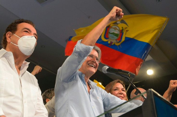 Former banker Guillermo Lasso (R) won Ecuador's presidential election after a campaign dominated by an economic crisis aggravated by the Covid-19 pandemic
