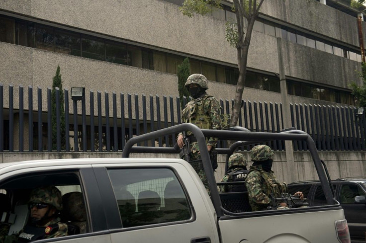 Thirty Mexican Navy Marines, similar to the ones pictured patrolling Mexico City in July 2013, have been arrested in connection with the disppearance of people in the northern state of Tamaulipas in 2014