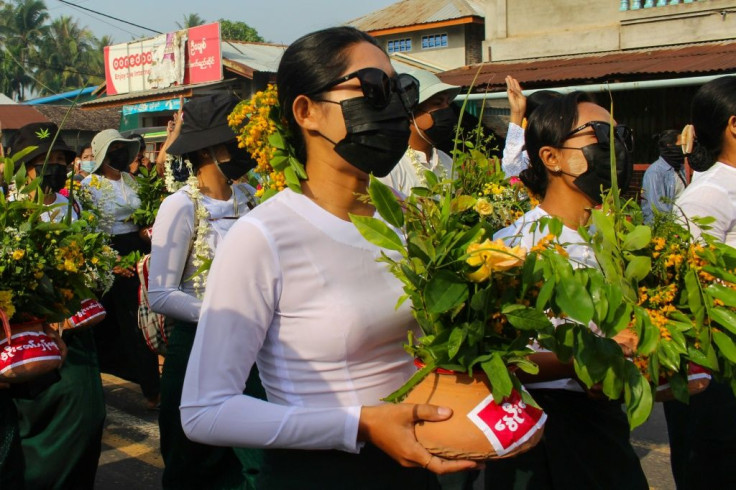 Protestors have been painting pro-democracy messages on clay flower pots traditionally displayed to welcome the Myanmar new year during the Thingyan festival