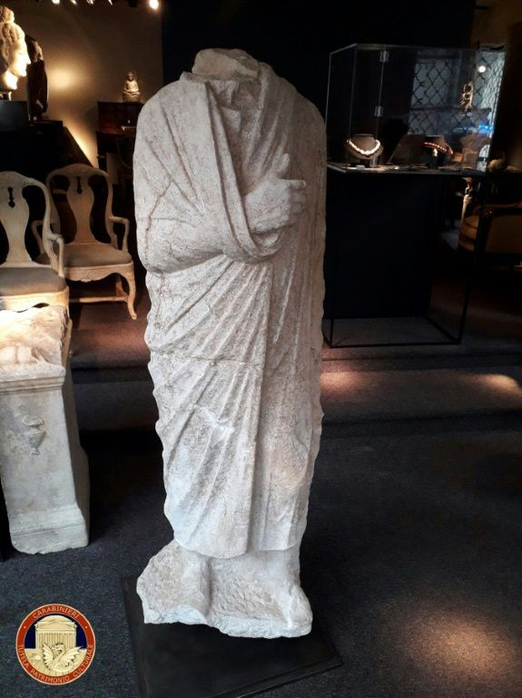 The "Togatus" marble piece, a full-body, headless 1st century statue of a toga-wearing man, was looted in 2011 from a villa in Rome