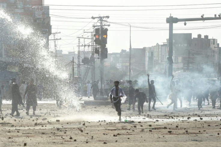 Police use water cannon to disperse supporters of the Tehreek-e-Labbaik Pakistan (TLP) party during a protest against the arrest of their leader