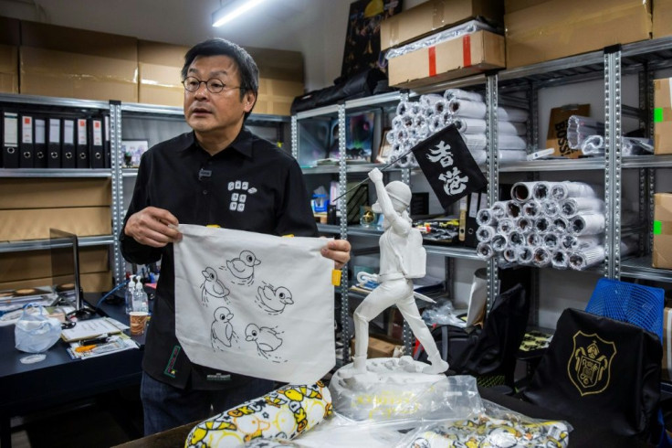 Chow makes no secret of his messaging -- the tote bag, for example, carries a referemce to popular Hong Kong protest slogan "Five demands, not one less"