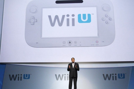 Fils-Aim, President of Nintendo of America, presents the new Wii U controller at a media briefing during the Electronic Entertainment Expo, or E3, in Los Angeles