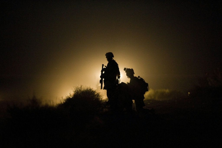 US Marines stand guard after a blast in Helmand province in 2009, in the first decade of the Afghan war which President Joe Biden says he will withdraw from