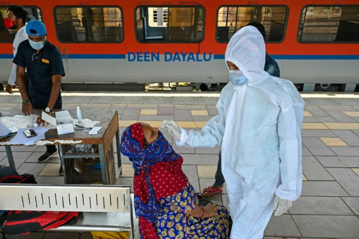 A woman gets a Covid test in Mumbai, India