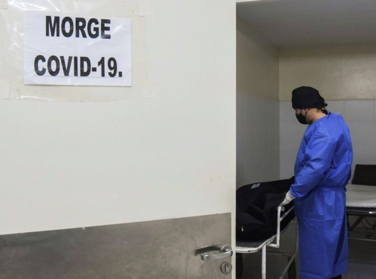 A healthworker at a morgue in Paraguay
