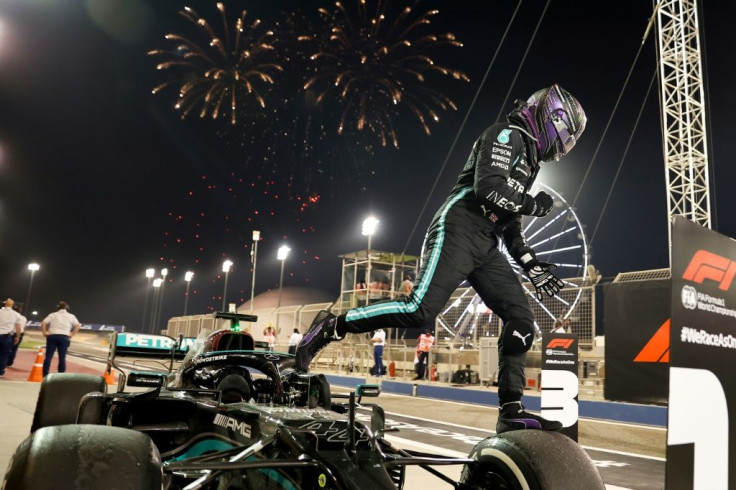 Winning start: Lewis Hamilton celebrates after victory in the season-opening Bahrain Grand Prix