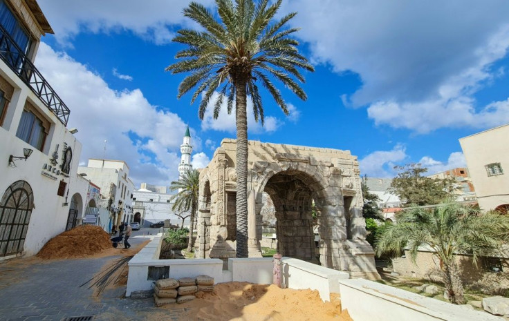 Labourers work near the Marcus Aurelius arch in Tripoli's old city