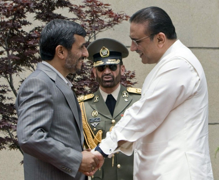 Iranian President Ahmadinejad greets Pakistan&#039;s President Zardari before the start of a trilateral summit in Tehran