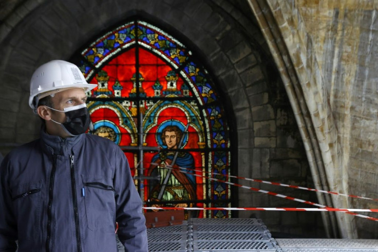 French President Emmanuel Macron visiting Notre-Dame two years to the day after the blaze said "immense" restoration work had already been accomplished