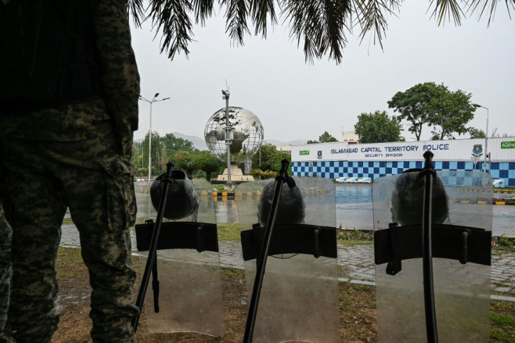 Paramilitary soldiers stand guard in front of the French embassy in Islamabad