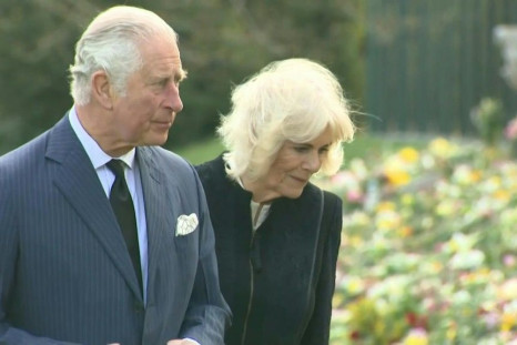 Prince Charles and his wife Camilla visit the garden of Marlborough House in London where the public has left flowers and notes in tribute to Prince Philip after he died on April 9 aged 99. Philip would have turned 100 in June. He was married to the Queen