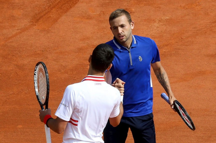 A memorable win: Dan Evans shakes hands with the vanquished Novak Djokovic