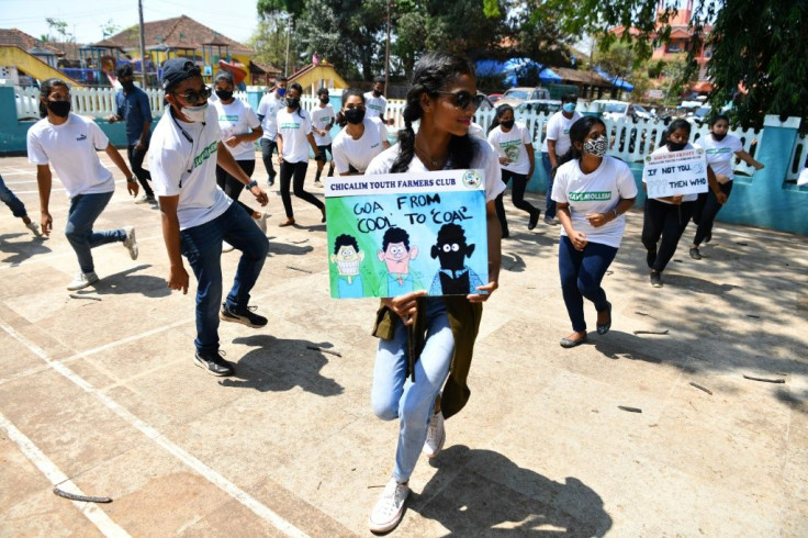Neola Sybil Pereira (C) dances with other activists during a flashmob at Altona in Goa, where a growing, youth-led environmental movement is rattling Indian authorities