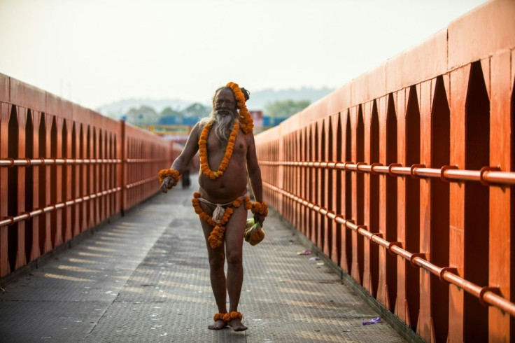 A holy man arrives to bathe in the Ganges river during the ongoing religious Kumbh Mela festival in Haridwar