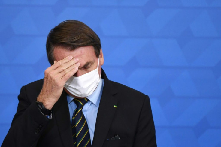 Brazilian President Jair Bolsonaro, seen in March 2021, has recommitted to a previous goal of ending illegal deforestation by 2030