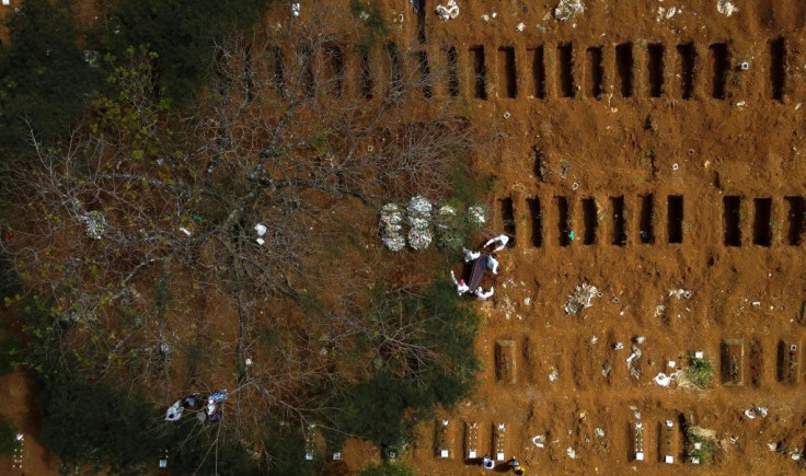 Fresh graves await more bodies at the Vila Formosa cemetery in Sao Paulo, Brazil, on April 14, 2021: the city has had to hire 50 vans to cope with the influx of the dead, as funeral homes ran out of space in their hearses