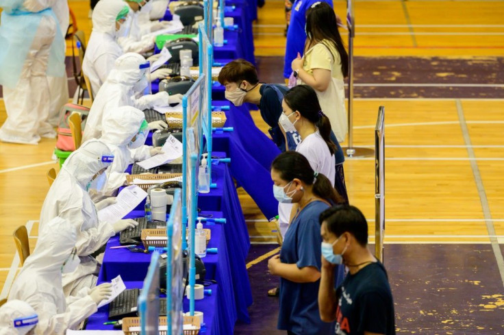 Bangkok residents get free Covid-19 tests at a city stadium