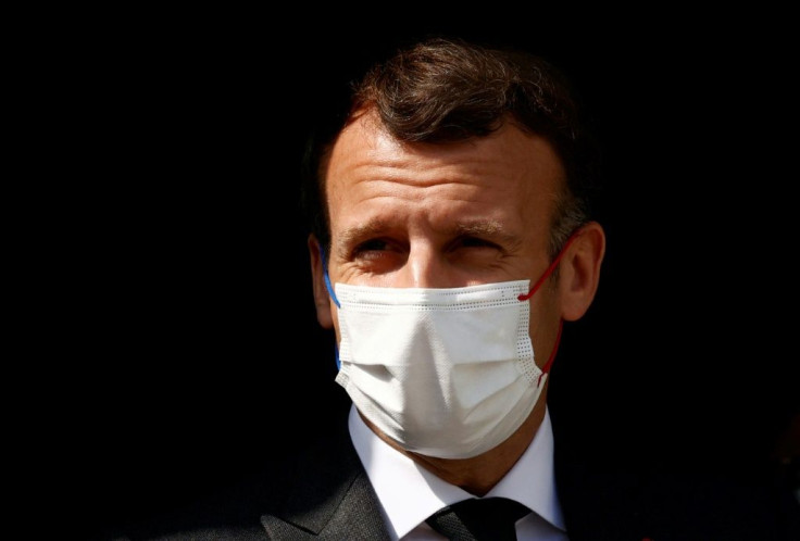 French President Emmanuel Macron, seen during a hospital visit in the city of Reims on April 14, 2021, has called for 'clear red lines' against unacceptable behavior by Moscow
