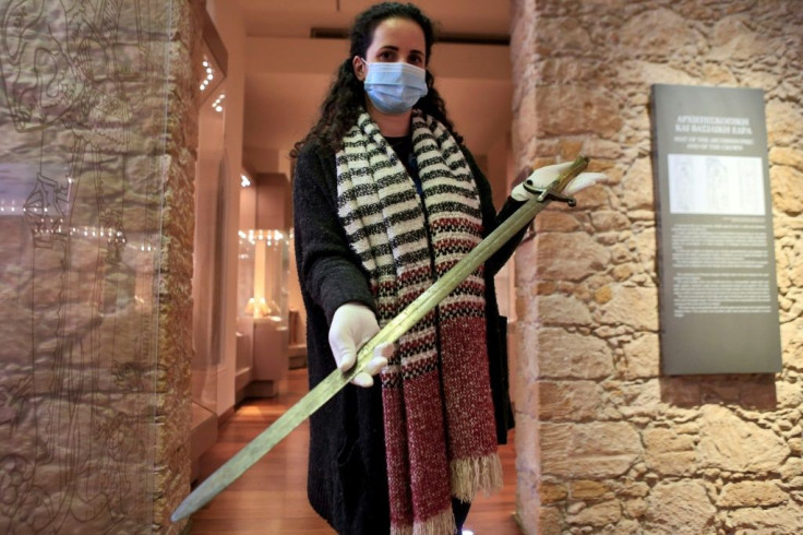 Maria Patsalosavvi, curator of the Leventis Municipal Museum in the Cypriot capital Nicosia, displays a crusader sword donated by Constantinos Emilianides, a private collector