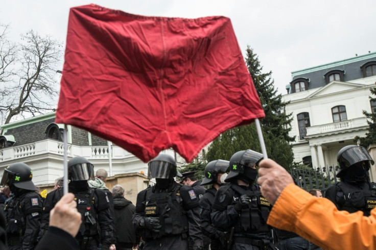 In Prague, angry protesters waved a red flag made of underwear and smeared the Russian embassy wall with blood-like ketchup