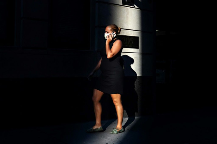 A person wearing a protective mask uses a cell phone as the city continues Phase 4 of re-opening following restrictions imposed to slow the spread of coronavirus on September 8, 2020 in New York City