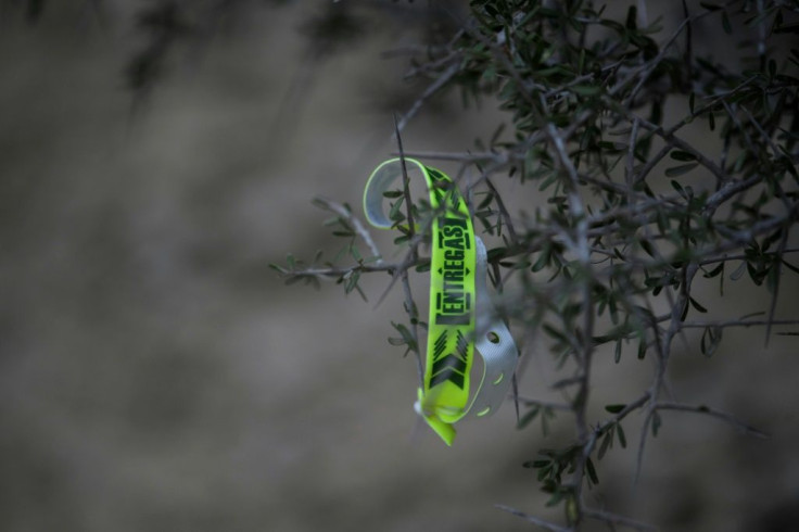 A bracelet used by people smugglers to keep track of migrants is seen discarded on the US side of the border with Mexico