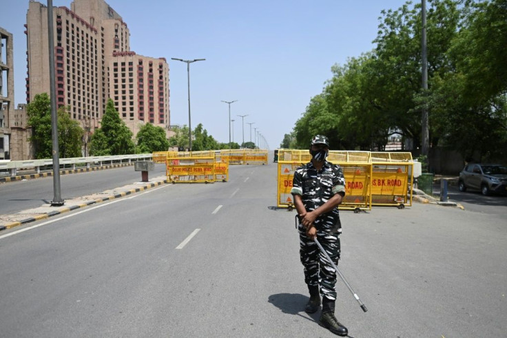A police officer at a checkpoint during a previous weekend lockdown in New Delhi