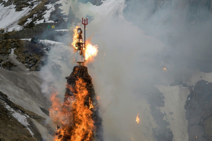 The snowman Boeoegg burns on a mountain pass in Switzerland as party of Zurich spring festival