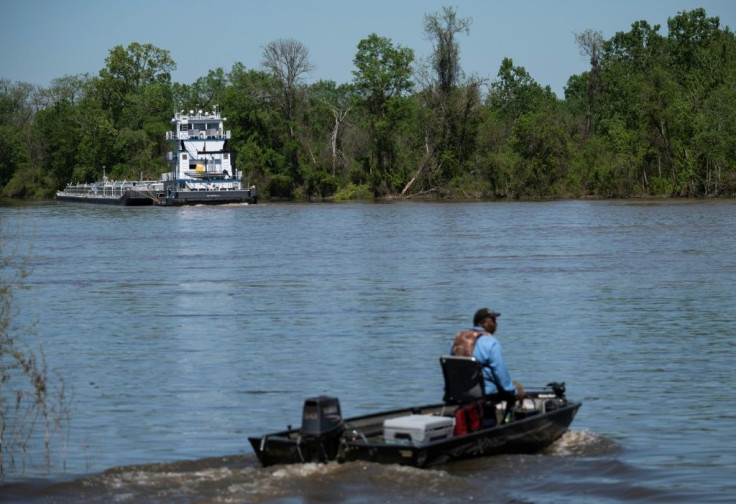 Chandler Bell, 51, heads out fishing on the Tombigbee River, which flows past two chemical plants in Alabama