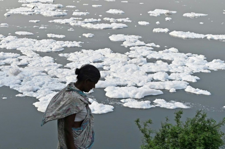 The river Yamuna in India is half covered with foam due to pollution