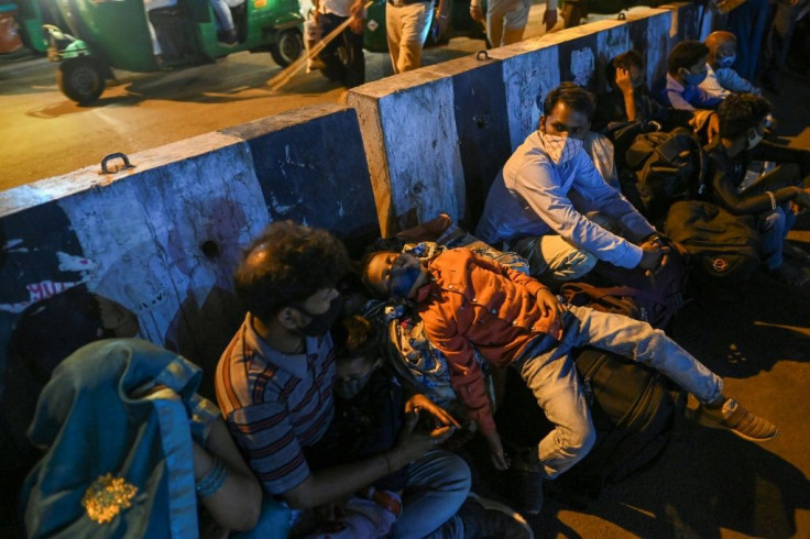 The looming virus lockdown of India's capital forced thousands to try and flee the restrictions
