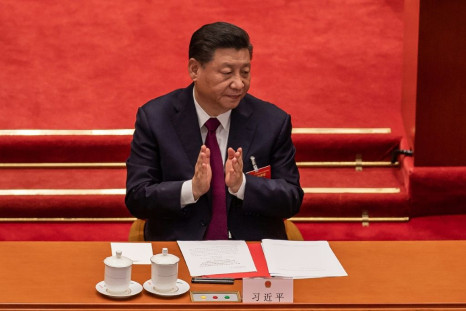 China's President Xi Jinping, seen in the Great Hall of the People in Beijing in March 2021, has tense relations with the United States but the two nations are looking to prioritize climate