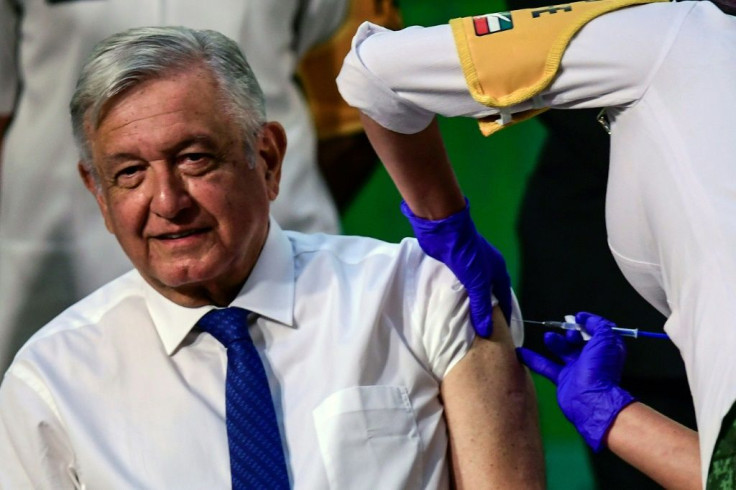 Mexican President Andres Manuel Lopez Obrador receives his first dose of the AstraZeneca coronavirus vaccine after his daily news conference