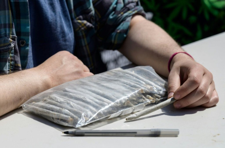 A marijuana activist waits to hand out free joints to vaccinated New Yorkers on April 20, 2021 in New York City