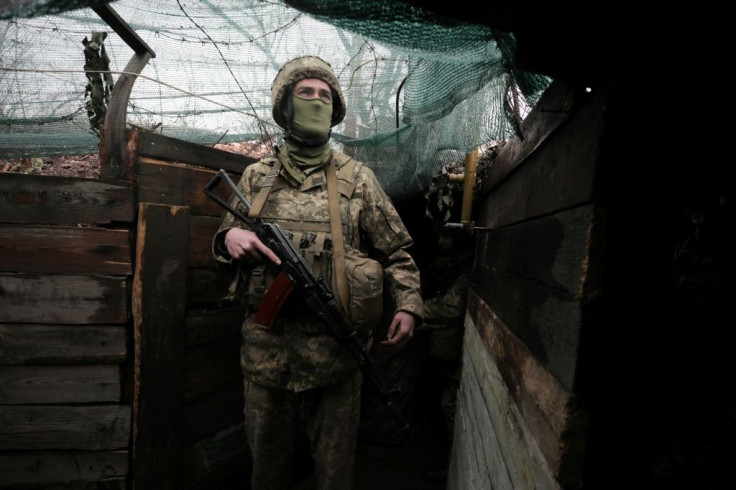 A Ukrainian serviceman stands on the frontline with Russian-backed seperatists in the Donetsk region