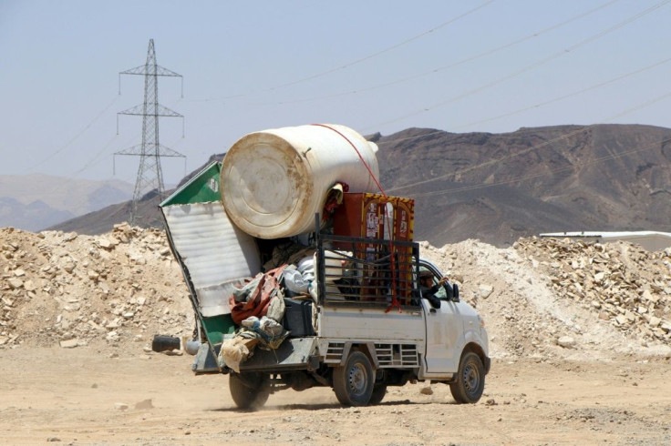 A car loaded with a cistern, a closet, and a TV at a camp for the internally displaced on the Marib's outskirts on March 28