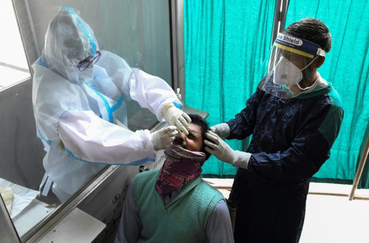 India's health system is being stretched to the limit by a second wave blamed on a "double mutant" variant and "super-spreader" mass gatherings