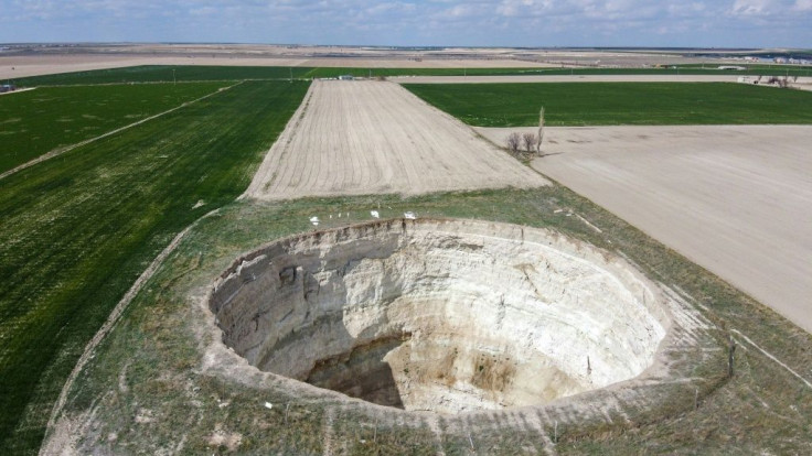 Sinkholes open up when underground caverns created by drought can no longer contain the weight of the layer of soil above