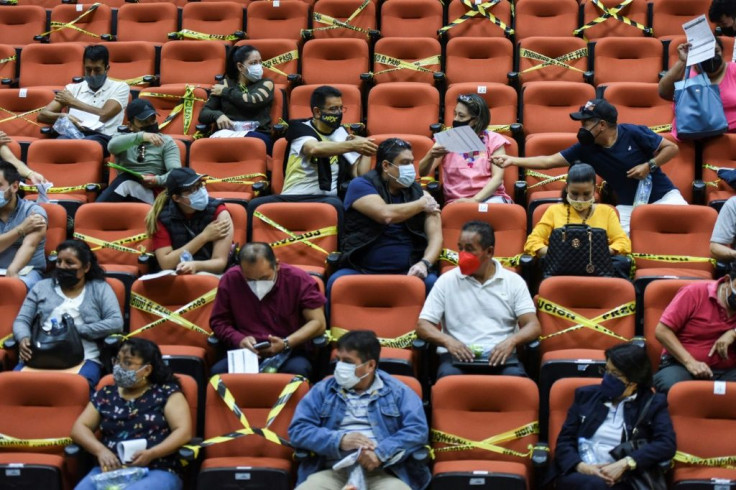 Teachers wait in observation after receiving a Covid-19 shot in San Cristobal, Mexico