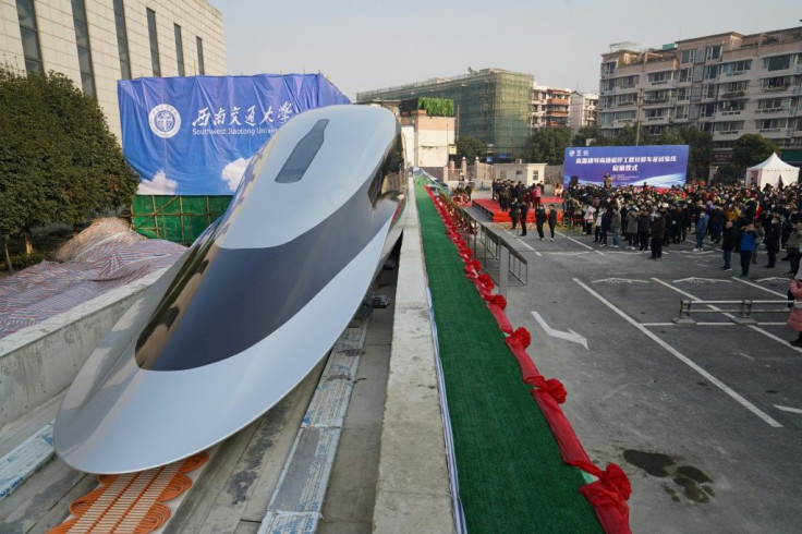 People visit a prototype magnetic levitation train developed with high-temperature superconducting in January 2021 in the Chinese city of Chengdu as the nation rapidly develops advanced rail