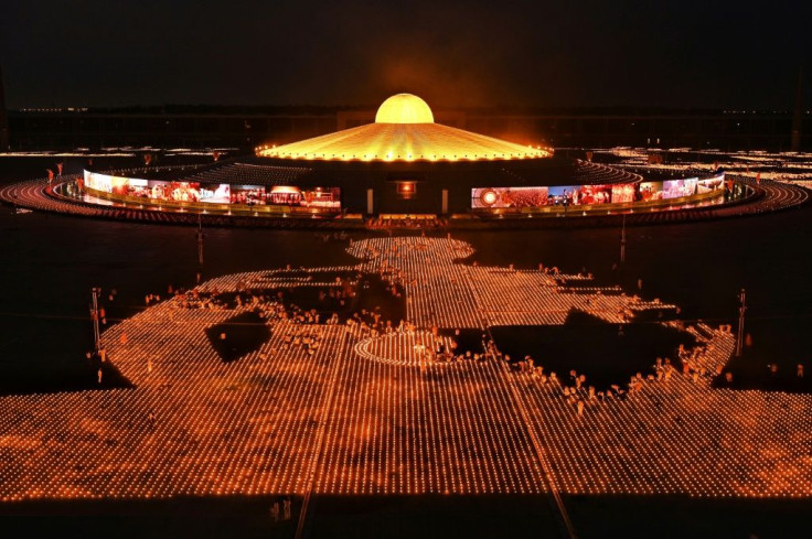 Thailand's Dhammakaya sect attempted to break a Guinness World Record for the largest flaming image to commemorate Earth Day