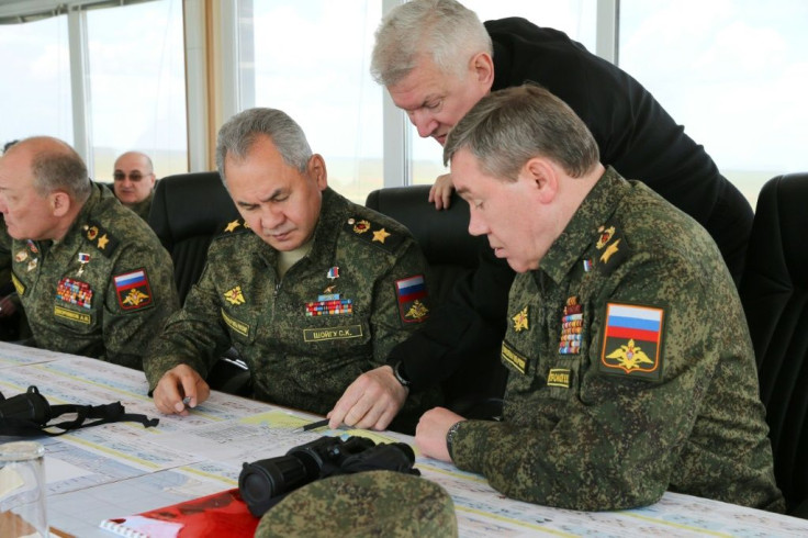Russian Defence Minister Sergei Shoigu (C) and Chief of the Russian General Staff Valery Gerasimov (R) oversee military drills the east of  Crimea