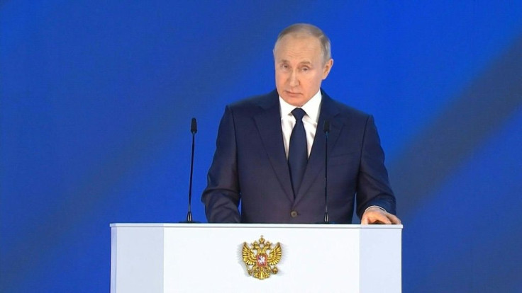 Russian President Vladimir Putin warns foreign rivals against "crossing the red line" with Moscow, as he gives a state of the nation address amid deep tensions with the West.