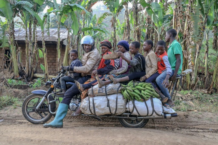 What, no kitchen sink? A giant motorbike in Cameroon takes a driver, six passengers and plenty of luggage